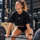 Vue avant du crop top noir French WOD Pain avec petit emblème blanc.